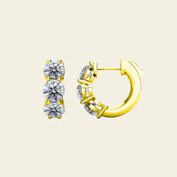 Pair of 3 stone diamond huggie gold earrings. 3-Stone Diamond Huggies. Solid gold and natural diamonds. Jewelry Dallas.