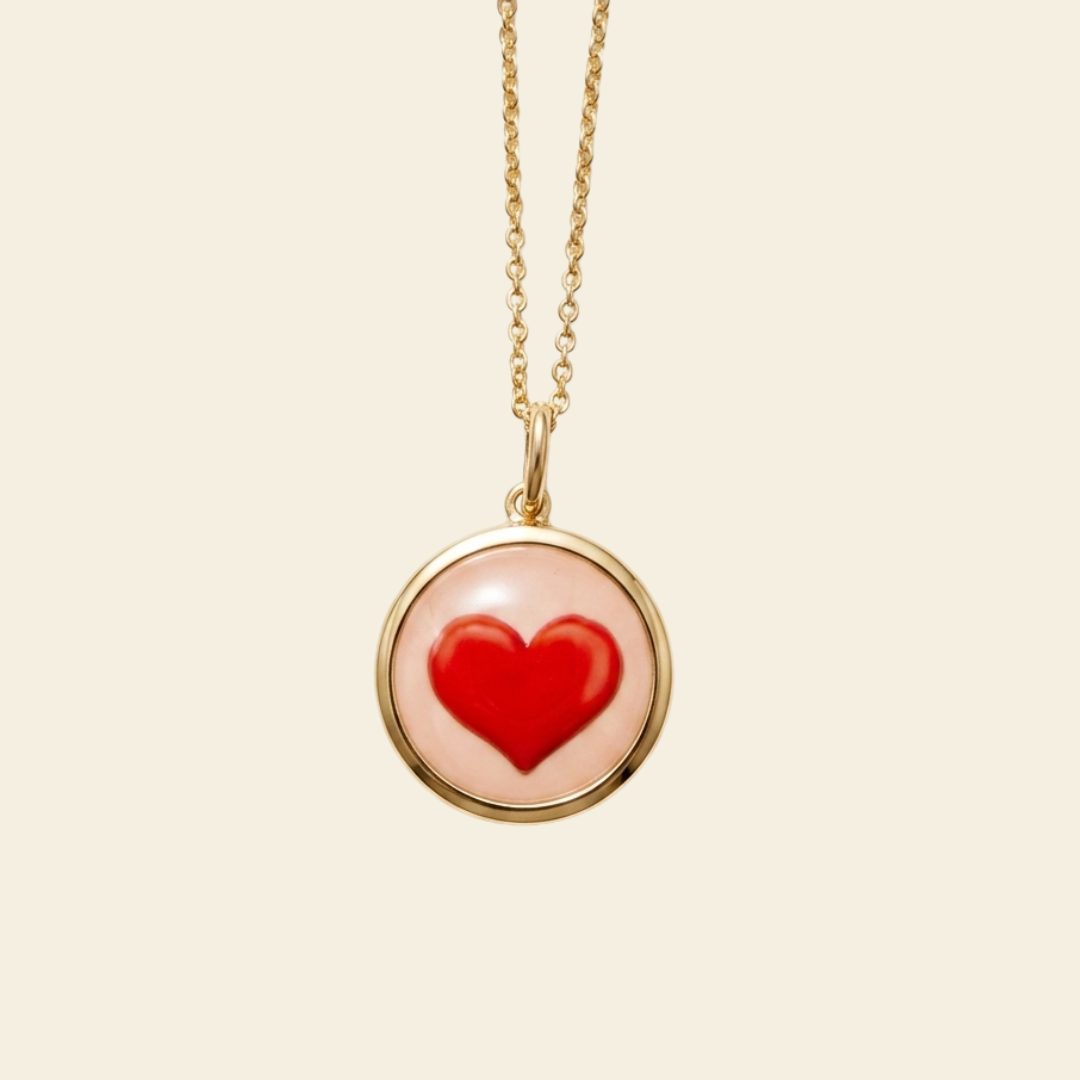 Necklace with a red heart pendant on a beige background