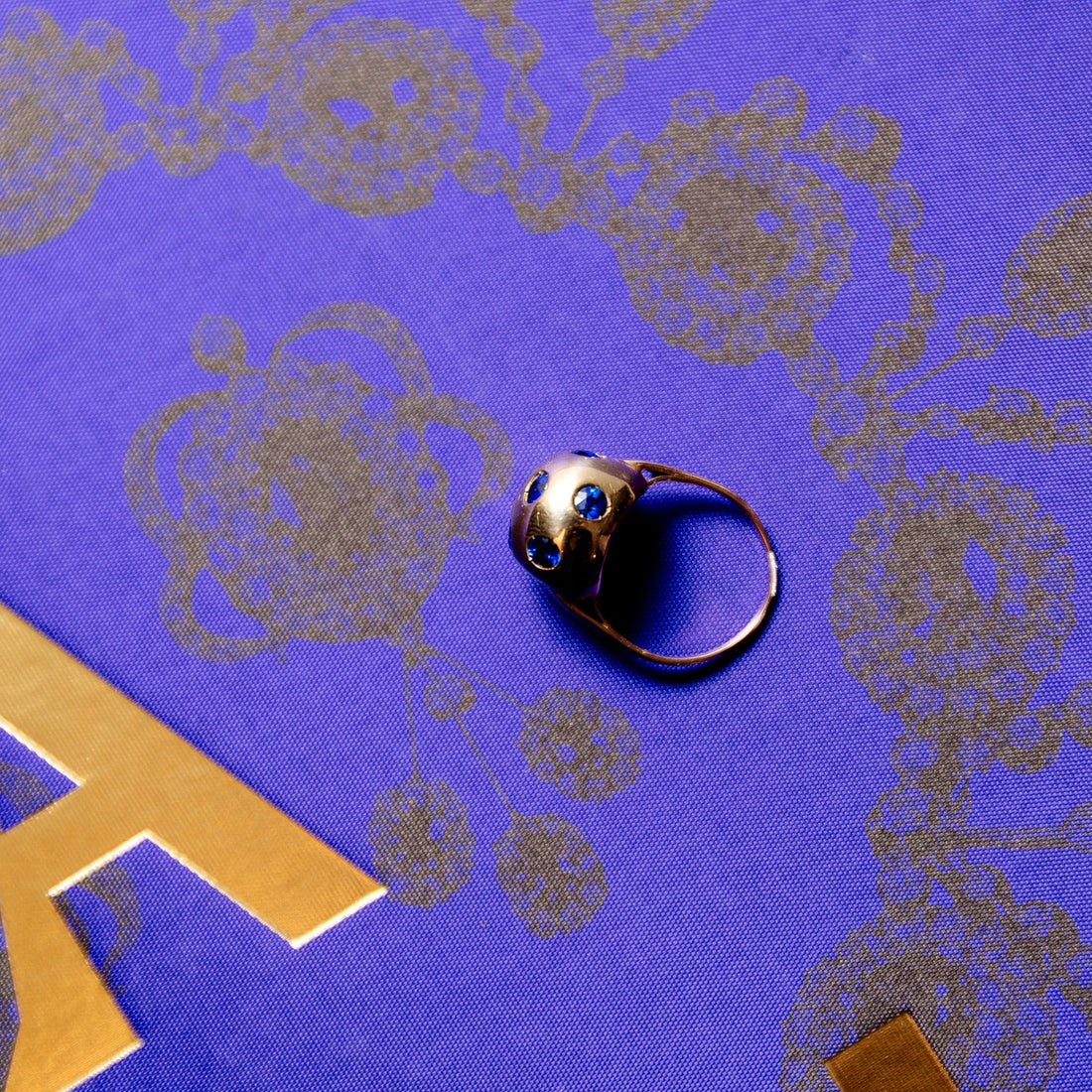 Globe ring on cream background