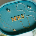 Jewelry set on a blue velvet tray with 'MRS' embroidery. Blue Velvet Jewelry Tray. Jewelry Dallas.