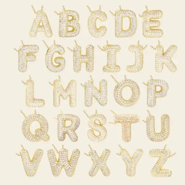 Gold alphabet letters on a beige background. Diamond Letter Pendant. Length and Layering: 16" Necklace with 2"Extension
Available in 14K Yellow Gold
Details: Initial with 1.00 carat of pavé diamonds in 14K Yellow Gold. Jewelry Dallas.