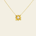 Gold necklace with a floral pendant on a beige background. Flower Power. Length: 16