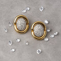 Gold earrings with diamond-pave centers. Gold & Diamond Pavé Oval Earrings. These oval earrings are crafted in rich 14k yellow gold and set with 1 carat of natural pavé diamonds for radiant sparkle. Jewelry Dallas. 