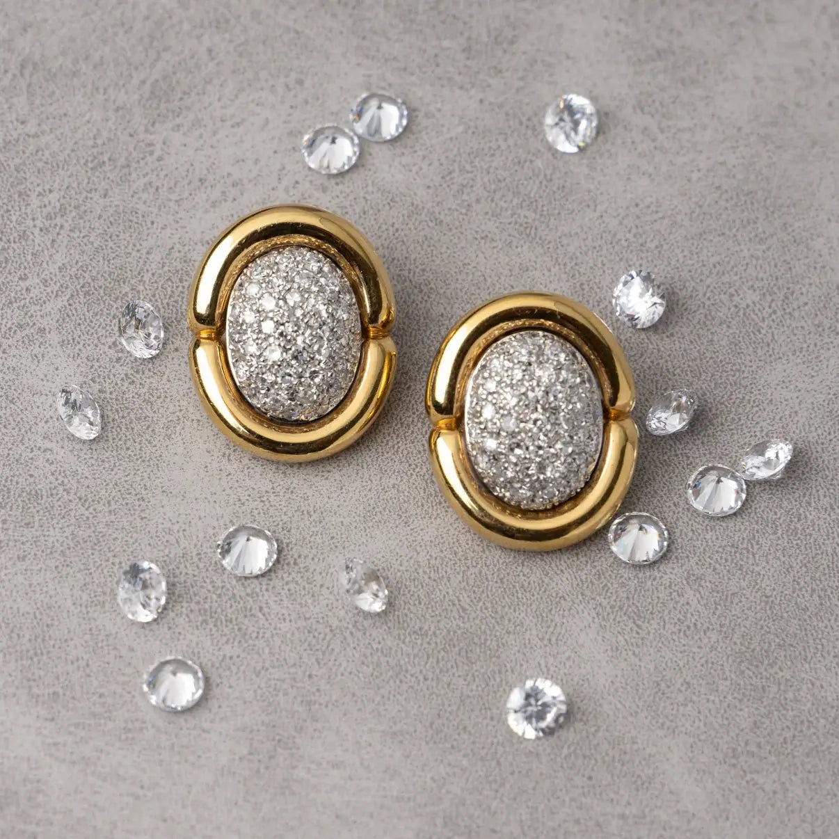 Gold earrings with diamond-pave centers. Gold & Diamond Pavé Oval Earrings. These oval earrings are crafted in rich 14k yellow gold and set with 1 carat of natural pavé diamonds for radiant sparkle. Jewelry Dallas. 