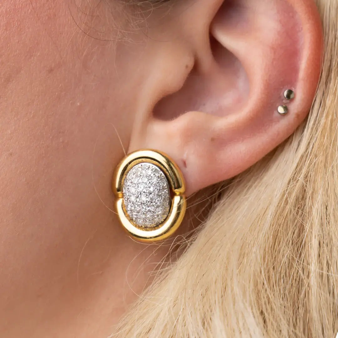 Gold earrings with diamond-pave centers. Gold & Diamond Pavé Oval Earrings. These oval earrings are crafted in rich 14k yellow gold and set with 1 carat of natural pavé diamonds for radiant sparkle. Jewelry Dallas.