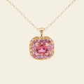 Gold necklace with a pink tourmaline gemstone pendant on a beige background. One-of-a-Kind Pendant with Pink Tourmaline. The pendant is set in solid 14K gold with a blend of polished and subtly textured details that add richness and character. It hangs from a 3.2mm rolo chain. Jewelry Dallas.