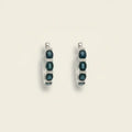 Pair of hoop earrings with blue sapphires and diamonds. Sapphire and Pave Diamond Hoops. Material: Solid 18kt White Gold with 0.47 carats of Natural Diamonds and Sapphires totaling 2.23 carats. Jewelry Dallas.