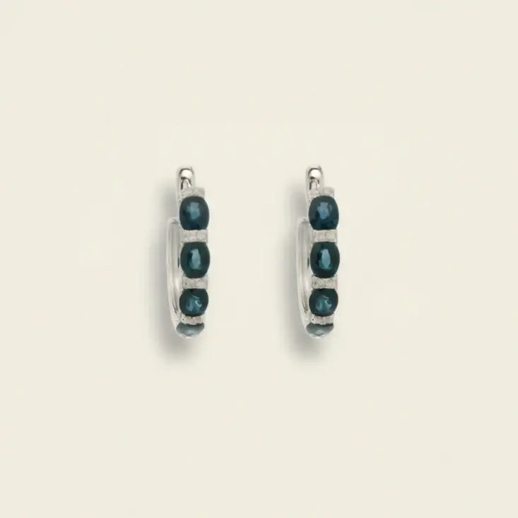 Pair of hoop earrings with blue sapphires and diamonds. Sapphire and Pave Diamond Hoops. Material: Solid 18kt White Gold with 0.47 carats of Natural Diamonds and Sapphires totaling 2.23 carats. Jewelry Dallas.
