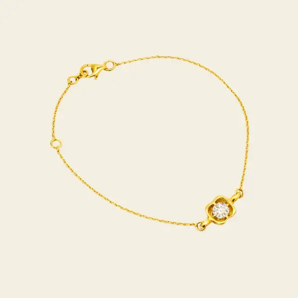 Gold bracelet with a diamond wax seal on a beige background. Wax Seal Bracelet. Length and Layering: 6" Bracelet with 1" Extension
Available in 14K Yellow Gold
Details: Wax seal charm set with 0.40 carat round natural diamond. Jewelry Dallas.