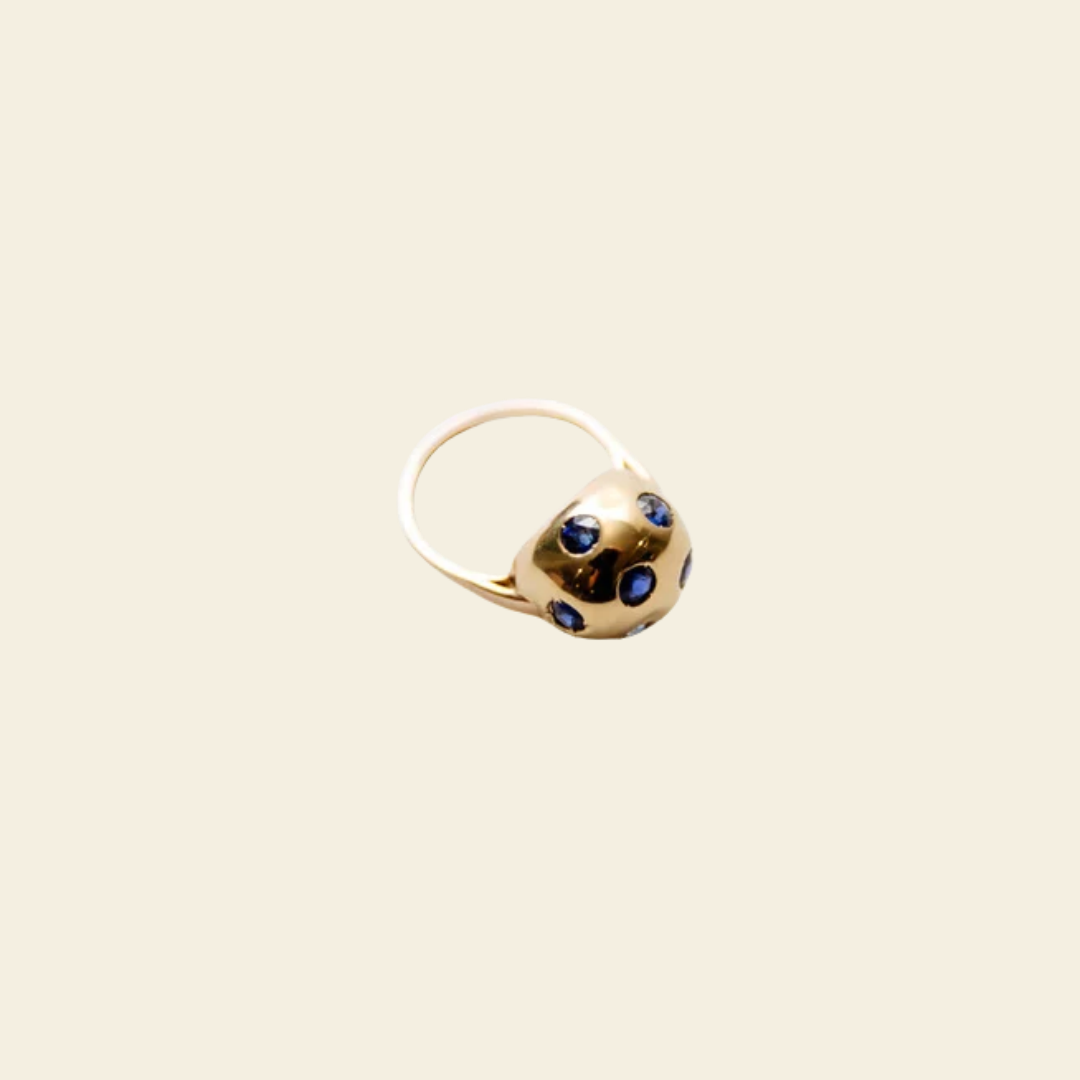 Globe ring on cream background