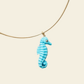 seahorse pendant on cream background